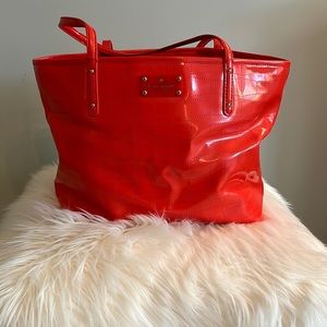 Kate Spade large coral patent bag with bow perforation